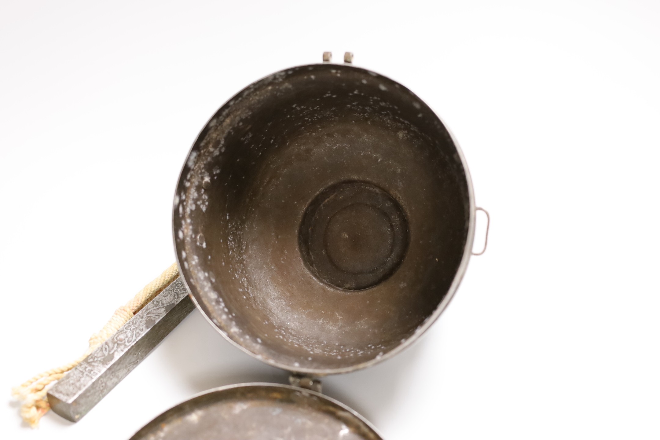 A Tibetan stunning weight, 21cm, and a Tibetan saddle storage pot